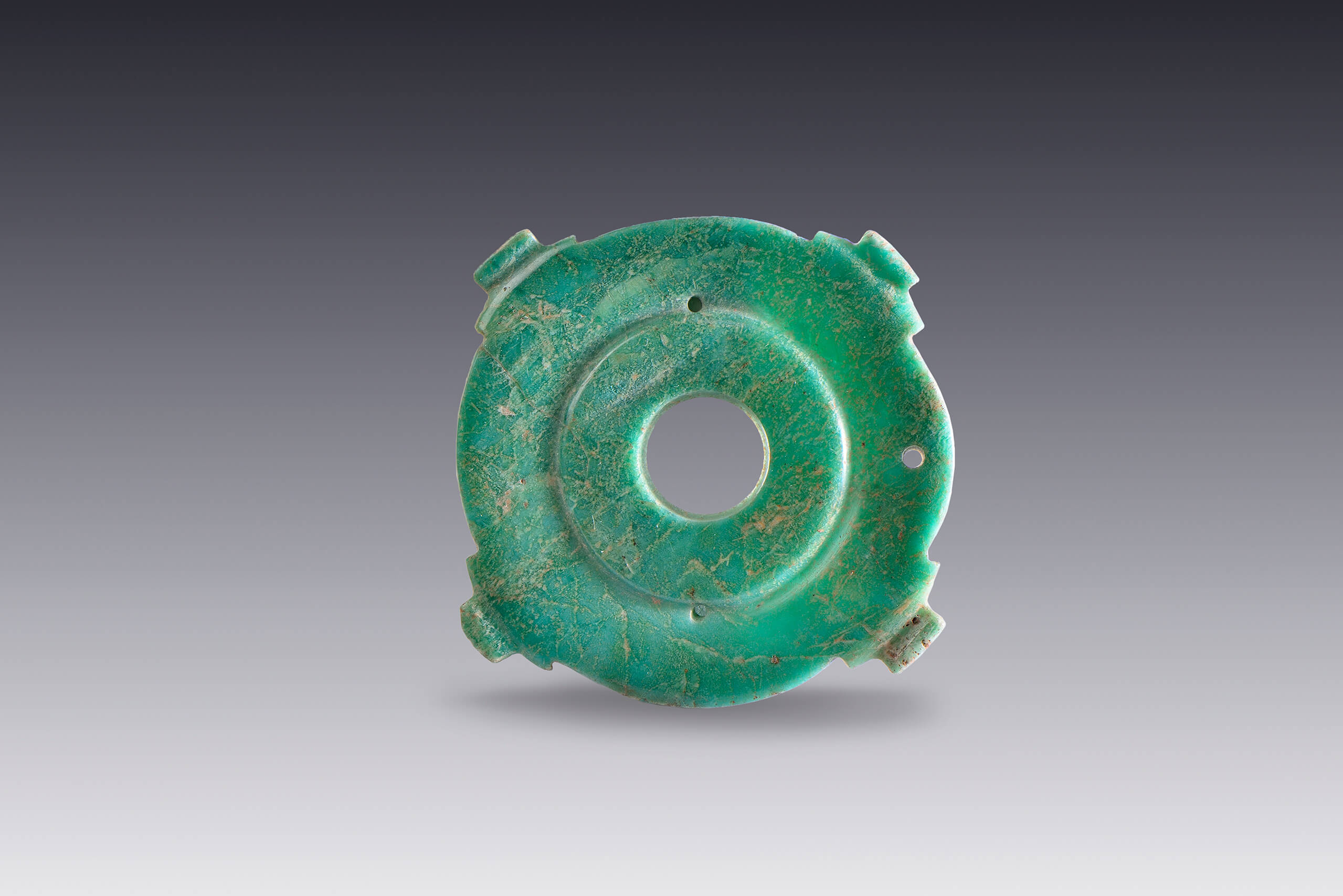 Medallones de piedra verde | El México antiguo. Salas de Arte Prehispánico | Museo Amparo, Puebla
