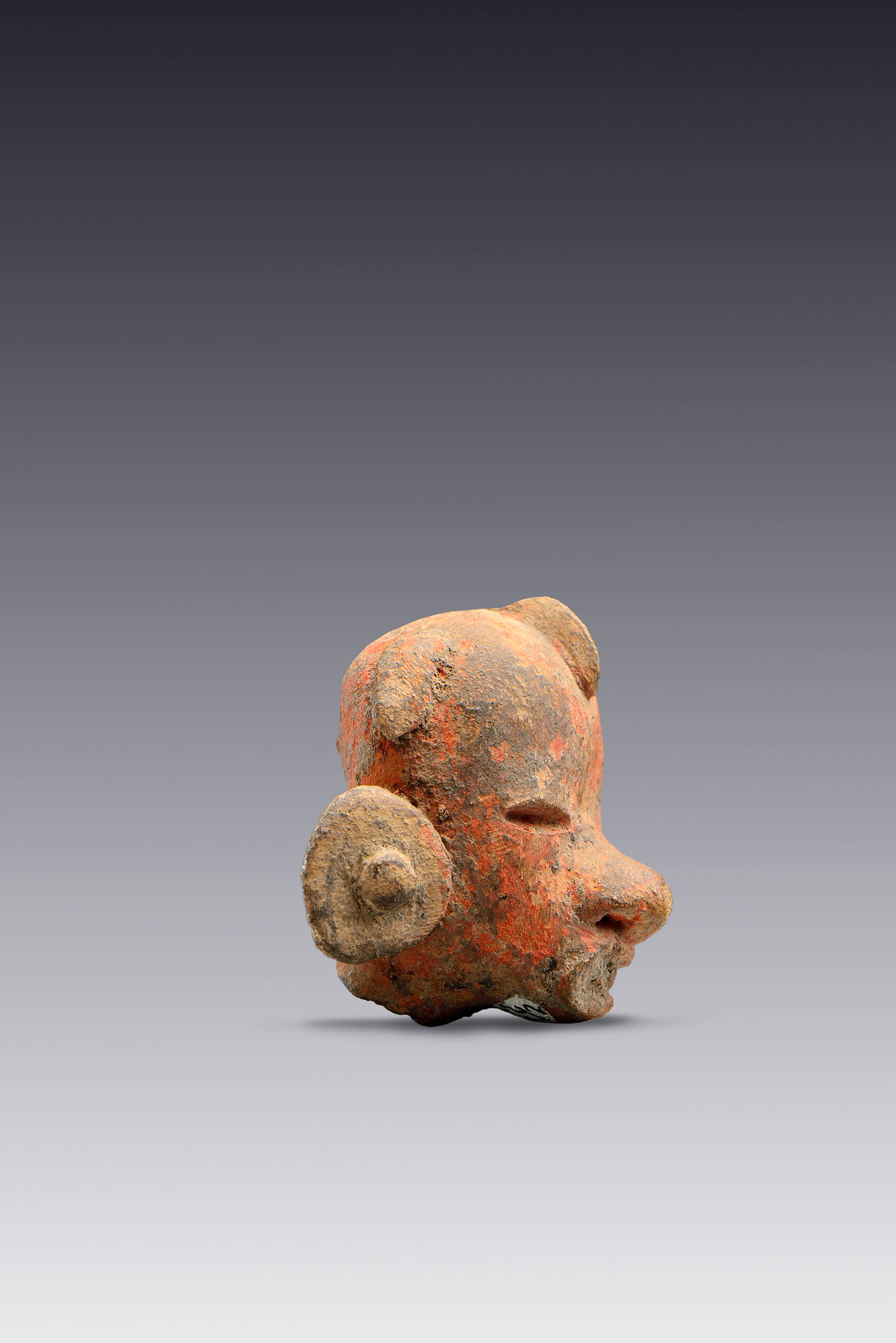 Cabezas de personajes con grandes orejeras | El México antiguo. Salas de Arte Prehispánico | Museo Amparo, Puebla
