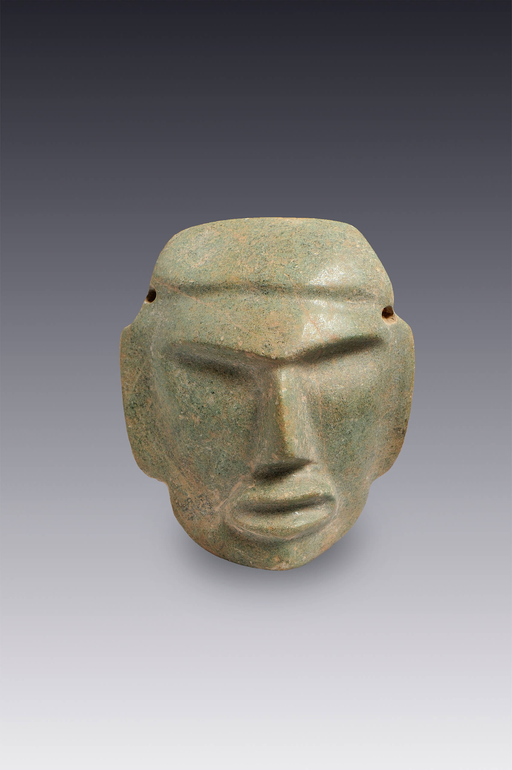 Máscara de un rostro humano de gesto adusto | El México antiguo. Salas de Arte Prehispánico | Museo Amparo, Puebla