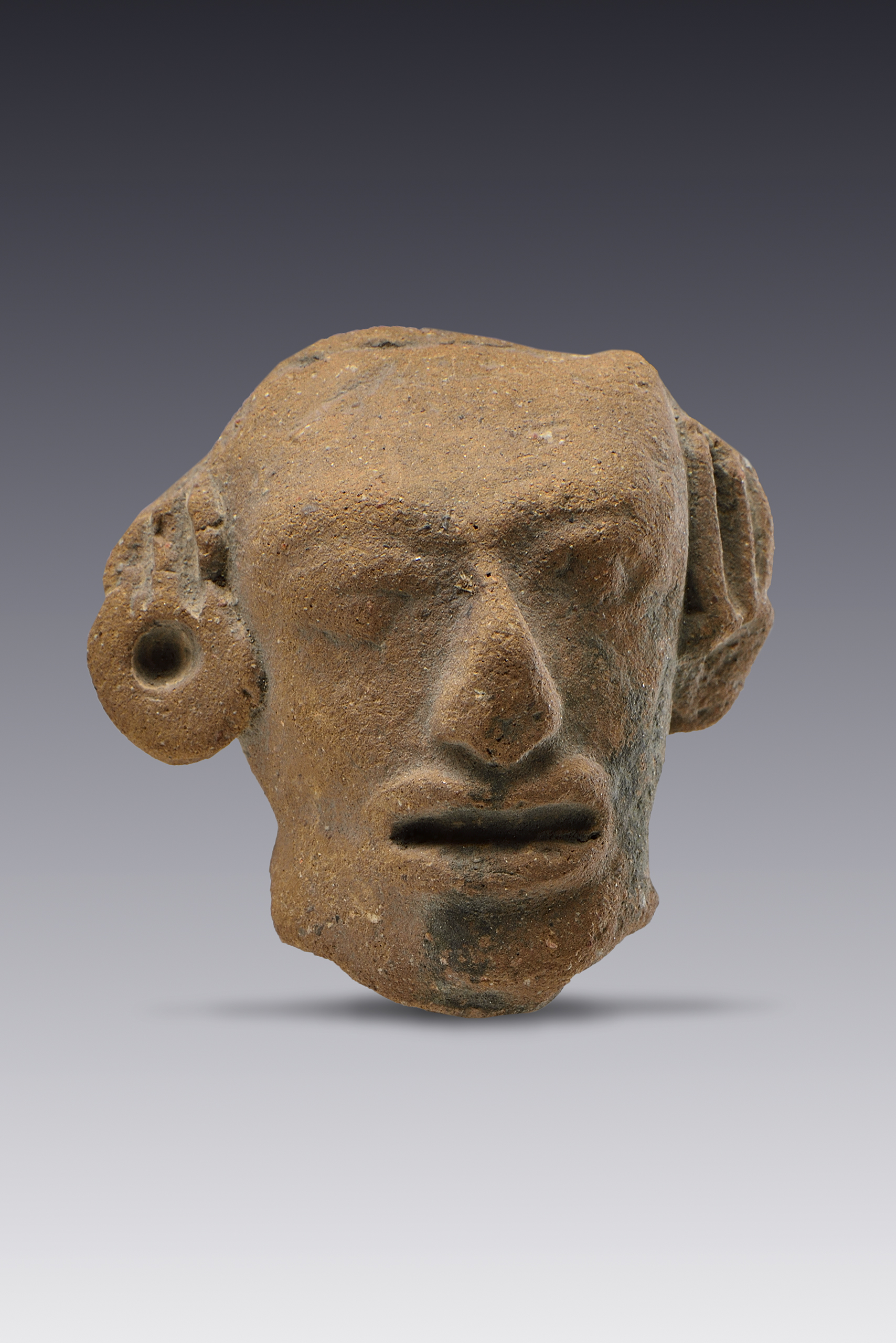 Cabeza de figurilla erosionada | El México antiguo. Salas de Arte Prehispánico | Museo Amparo, Puebla