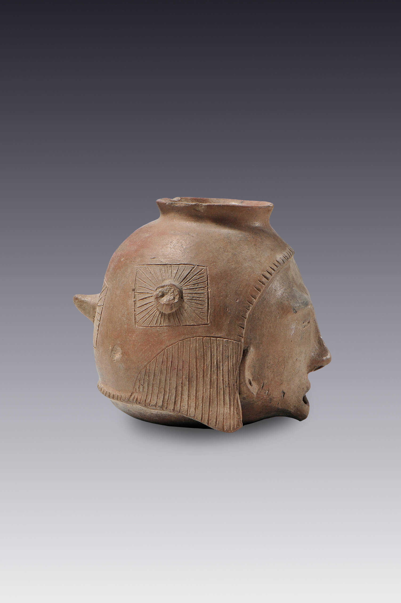 Olla con forma de cabeza trofeo | El México antiguo. Salas de Arte Prehispánico | Museo Amparo, Puebla