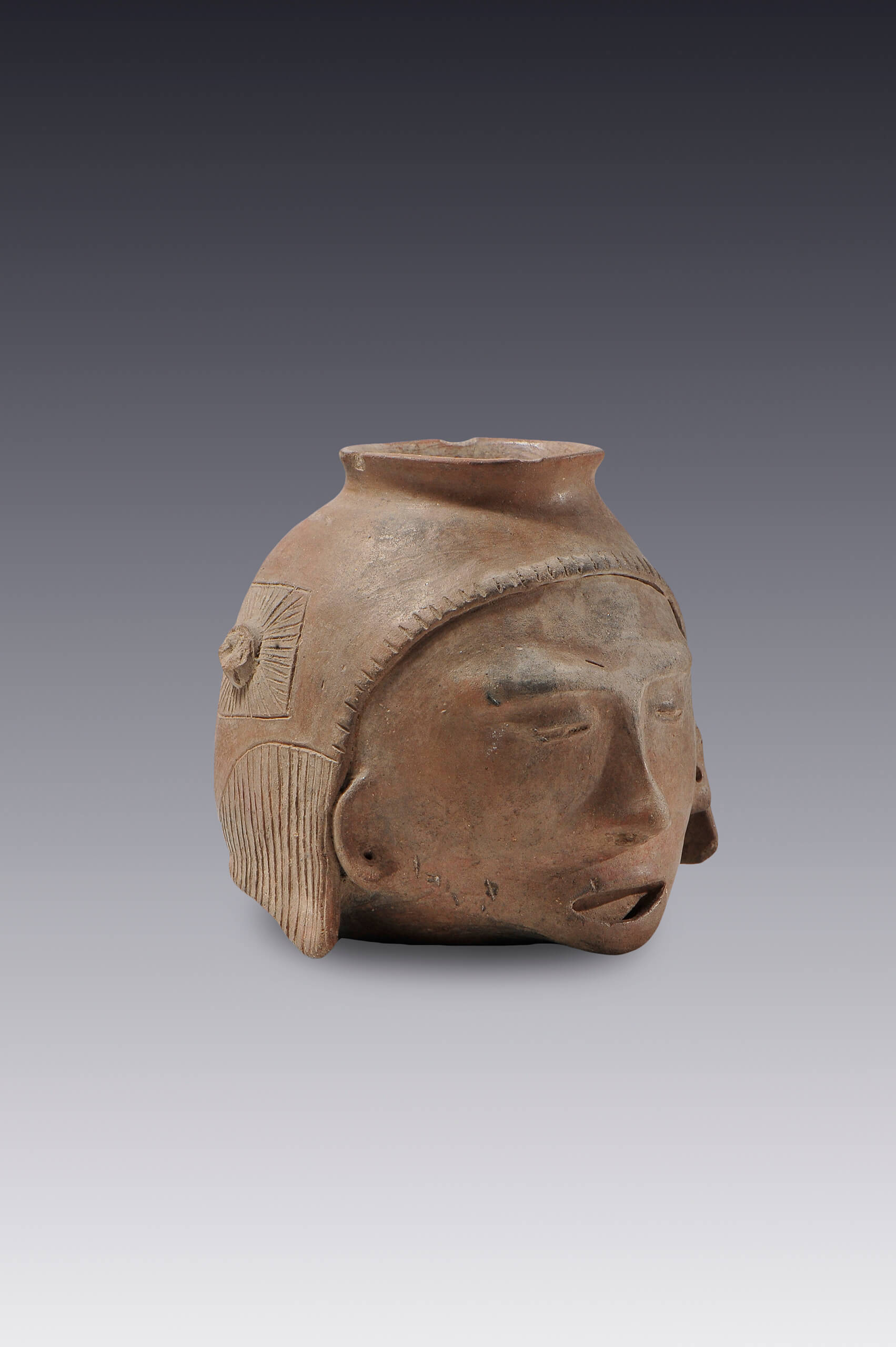 Olla con forma de cabeza trofeo | El México antiguo. Salas de Arte Prehispánico | Museo Amparo, Puebla