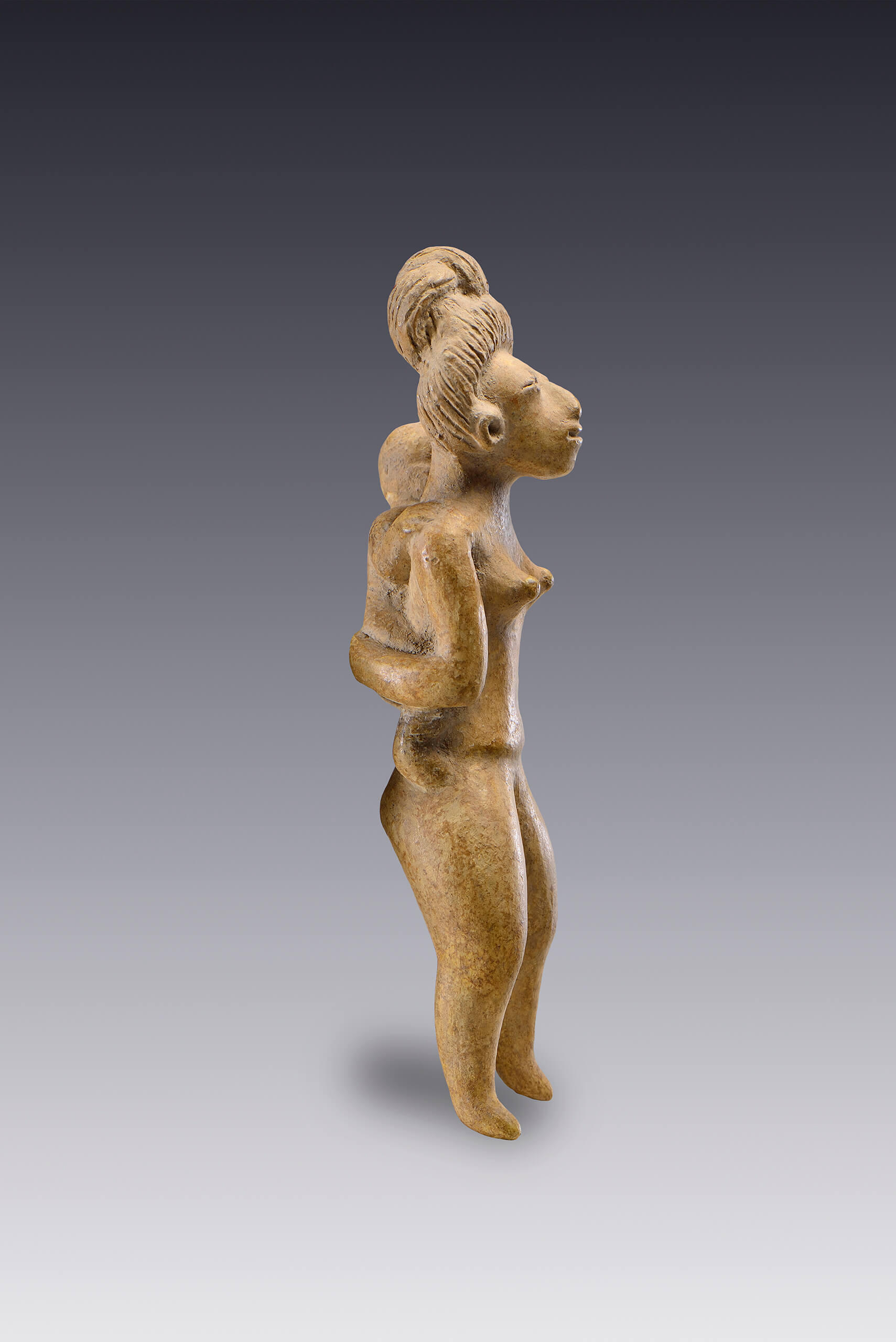 Mujer con niño a cuestas | El México antiguo. Salas de Arte Prehispánico | Museo Amparo, Puebla