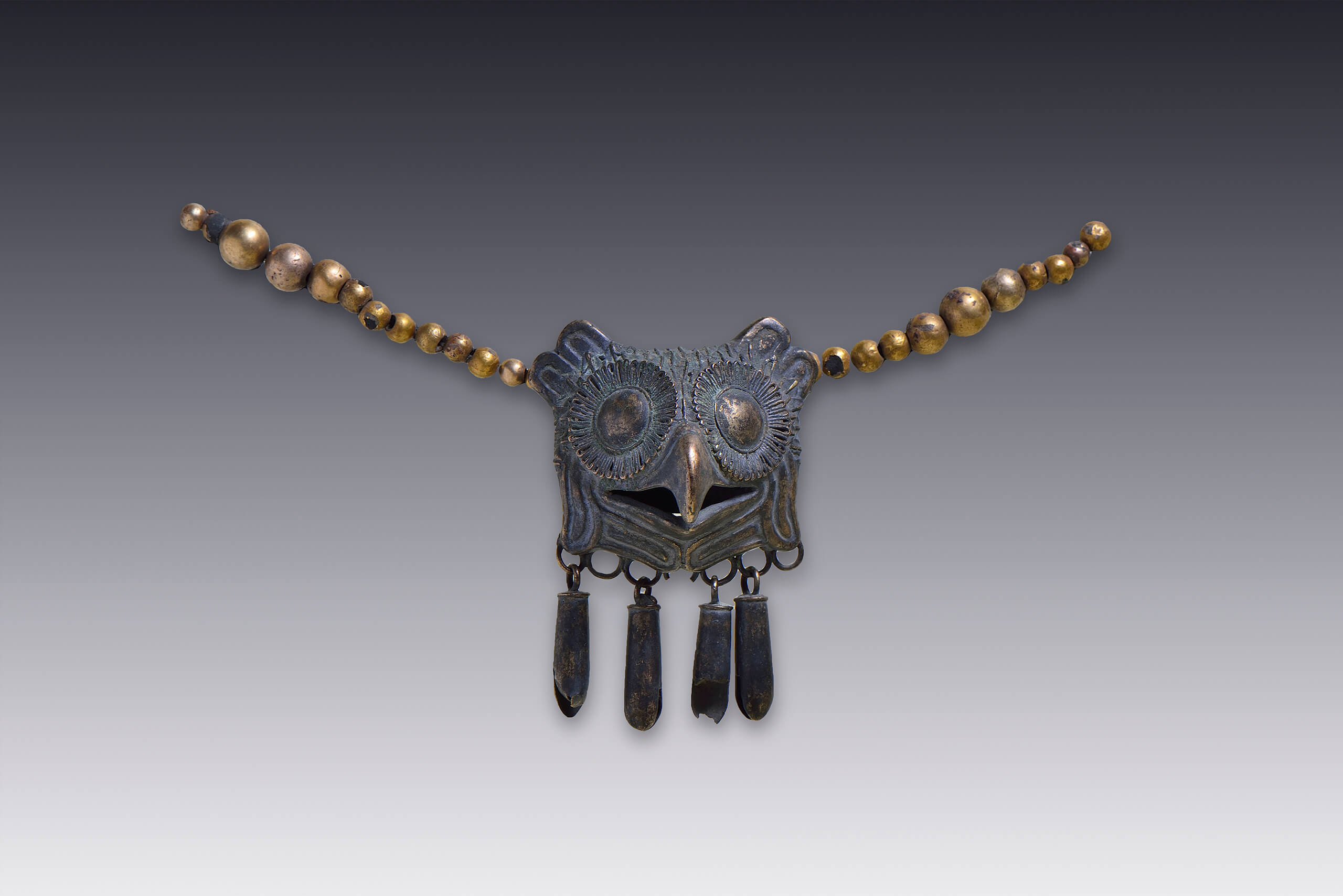 Medallón de cabeza de búho | El México antiguo. Salas de Arte Prehispánico | Museo Amparo, Puebla